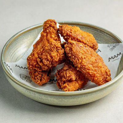 Куриные крылышки в Mama ресторан по цене 630 ₽