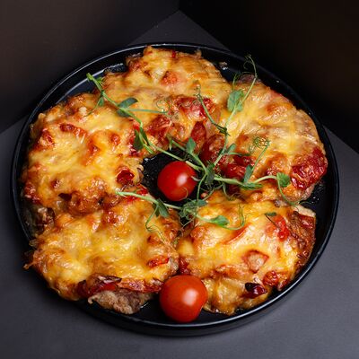 Отбивная из свинины с сыром в Рябинушка по цене 420 ₽