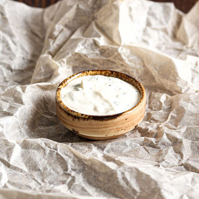 Соус чесночный в Хинкали Домашние традиции по цене 70 ₽