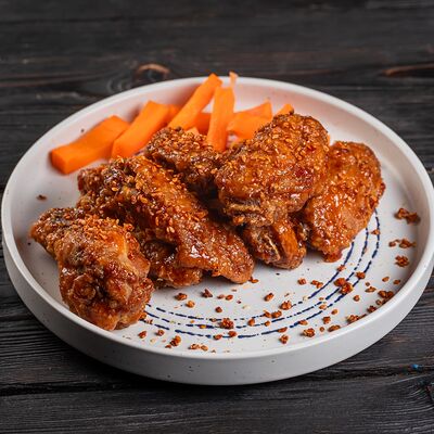 Куриные крылья в соусе по-тайски в Паб Мира по цене 560 ₽