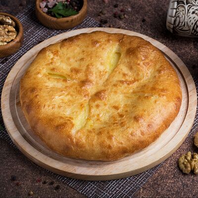 Осетинский пирог с картошкой и сыром в Грузинская пекарня по цене 479 ₽