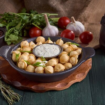 Пельмешки жареные в Ohooligans по цене 489 ₽