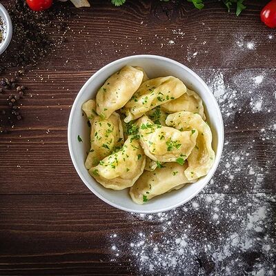 Фирменные вареники с картофелем и грибами в Пиццбург & Roll по цене 320 ₽