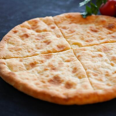 Осетинский пирог с картофелем и сыром в Хинкальная по цене 595 ₽