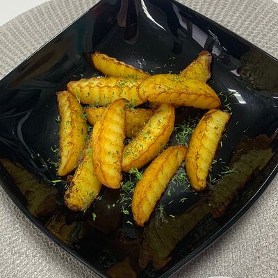 Картофель по-деревенски в Райский дворик по цене 250 ₽