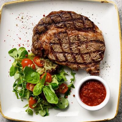 Стейк Рибай из мраморный говядины в Si M patio по цене 4999 ₽