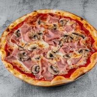 Пицца с ветчиной и грибами в Bocconcino
