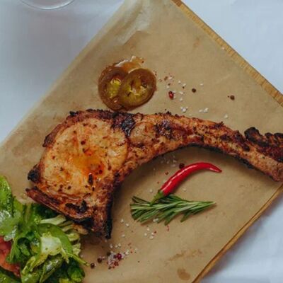 Стейк Томагавк в Роланд по цене 1020 ₽