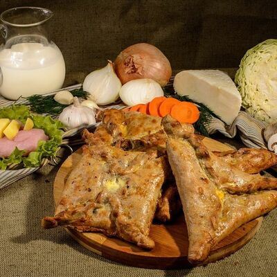 Чукуры с зелёным луком и яйцом в Пироги по-коми по цене 1268 ₽