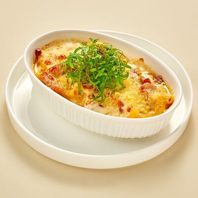 Тортильони, запеченные с беконом яйцом и моцареллой в Регано по цене 575 ₽