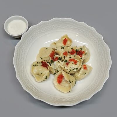 Пельмени из щуки со сметаной и икрой форели в Мёд и Масло по цене 797 ₽