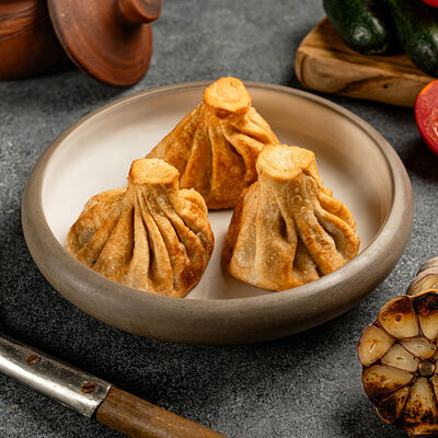 Жареные хинкали с говядиной и свининой (3шт) в Shemodi Шемоди по цене 477 ₽