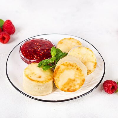 Сырники творожные с малиновым вареньем в У Палыча. С пылу, с жару! по цене 355 ₽