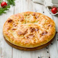 Хачапури круглый с сыром и зеленью в Густо Итальяно