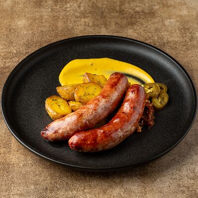 Колбаса из косули с молодым картофелем, тушеной капустой и горчичным соусом в Егерь по цене 1310 ₽