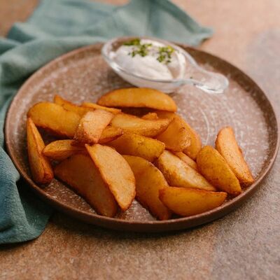 Картофельные дольки в Krutli по цене 308 ₽