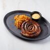 Колбаски на гриле с тушеной капустой и дижонской горчицей в Brasserie Lambic по цене 870