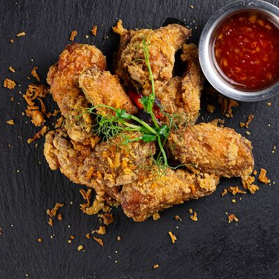 Куриные крылышки с тайским соусом в Pho Tuk Tuk по цене 710 ₽