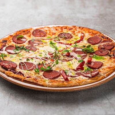 Пицца с Салями и копчёным перцем в Саттва по цене 580 ₽