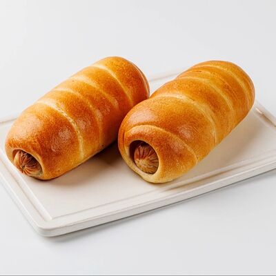 Сосиска в тестев Дом хлеба по цене 110 ₽