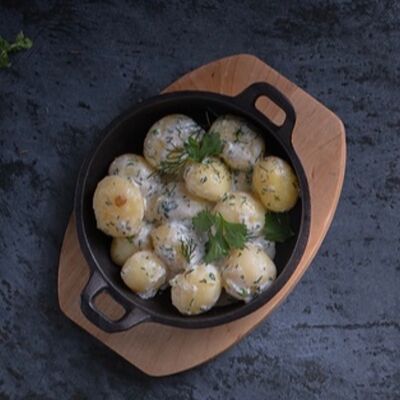 Молодой картофель в сливочном соусе в Асгард по цене 363 ₽