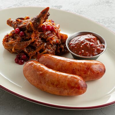 Пикантные колбаски с сыром и тушеной капустой в Jager restopub по цене 820 ₽