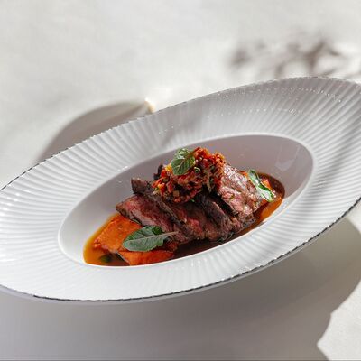 Стейк бавет с печёной тыквой и соусом из сычуаньского перцав Cristal по цене 1300 ₽