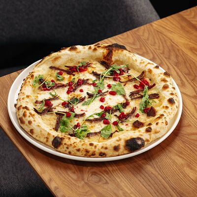 Томленая оленина с брусничным соусом в Misto по цене 1270 ₽