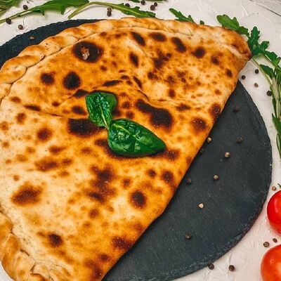 Кальцоне Болоньезе в Pizza della Casa пиццерия по цене 559 ₽