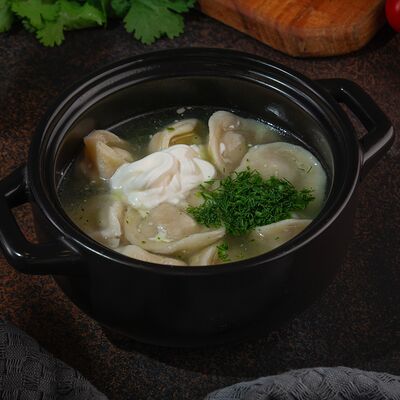 Пельмени с бульоном в Райхон по цене 290 ₽