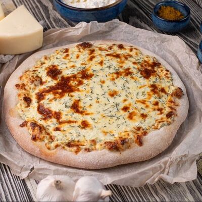 Пицца с творогом и зеленью в Линдфорс по цене 1400 ₽