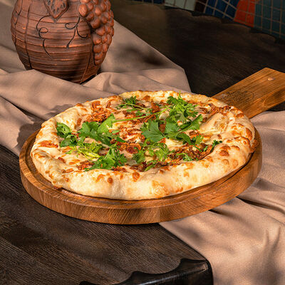 Хачапури с луком фри и имбирным соусом в Аджикинежаль по цене 670 ₽