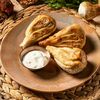 Жареные хинкали с вешенками, белыми грибами и сулугуни в Джонджоли по цене 610