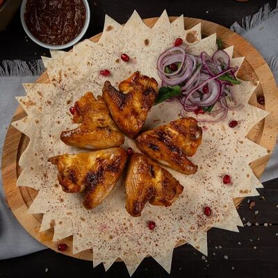 Шашлык из куриных крылышек в Мангал Хаус по цене 320 ₽