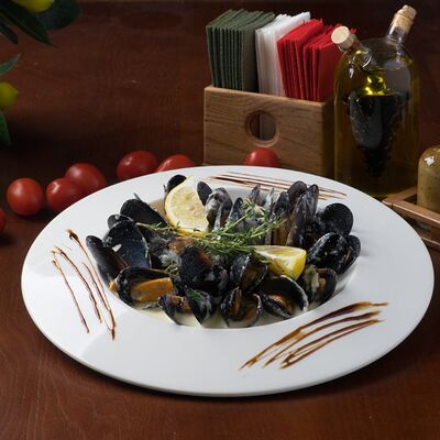 Мидии в сливочном соусе с пармезаном в Лимончини по цене 990 ₽