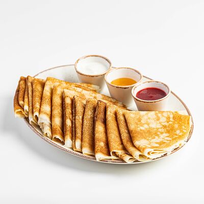 Стопка 12 блинов со сметаной в Kitchen по цене 1150 ₽