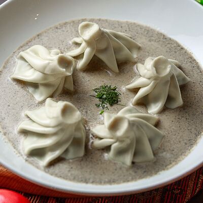 Мини хинкали с грибами в соусе чкмерули в Чито-Грито по цене 630 ₽