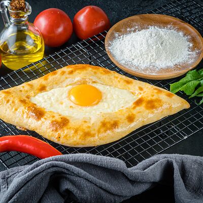 Хачапури по-аджарски в Ресторан Воробьёвы Горы PREMIUM по цене 748 ₽