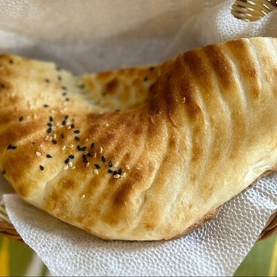 Пол лепешки (кульча) в Чайхана маркет по цене 45 ₽