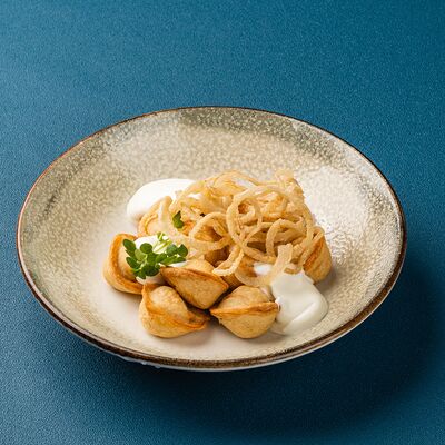 Пельмени с курицей жареные в Мираж по цене 240 ₽