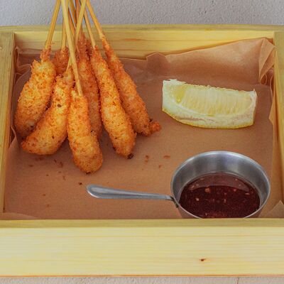 Тигровые креветки в сухарях на шпажках в Daddys pub по цене 1095 ₽