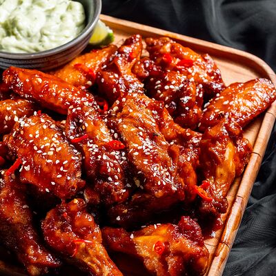 Куриные крылышки в остром соусев Gatsby по цене 830 ₽