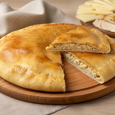 Осетинский пирог с курицей и сыром в Пироги из печи по цене 740 ₽