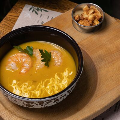 Тыквенный крем-суп с креветкой в Уголёк по цене 430 ₽