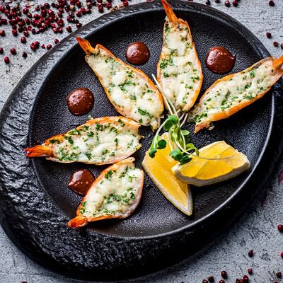 Запеченные лангустины с сыром моцарелла и пармезаном в Edateca Едатека по цене 890 ₽