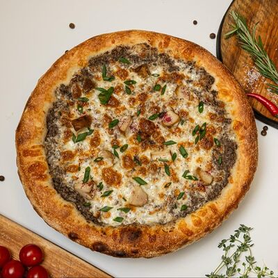 Пицца белые грибы на жульене в Ели Поели по цене 1200 ₽