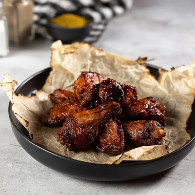 Куриные крылья с соусом барбекю в КрафтБургерБар по цене 710 ₽