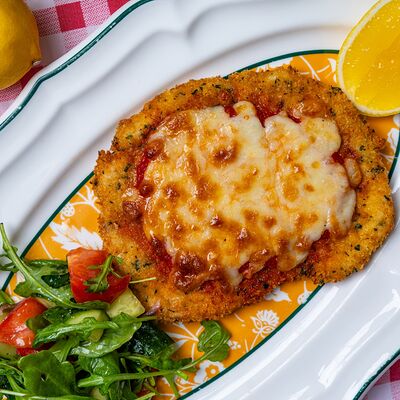 Куриный шницель с пармеджано в Итальянцы по цене 610 ₽