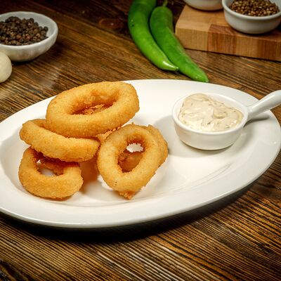 Кольца из кальмара с соусом тартар в Пловная по цене 380 ₽