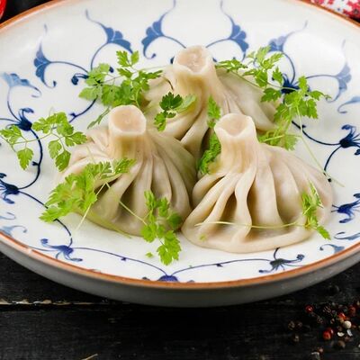 Хинкали со свининой и говядинойв Славянский базаръ по цене 130 ₽